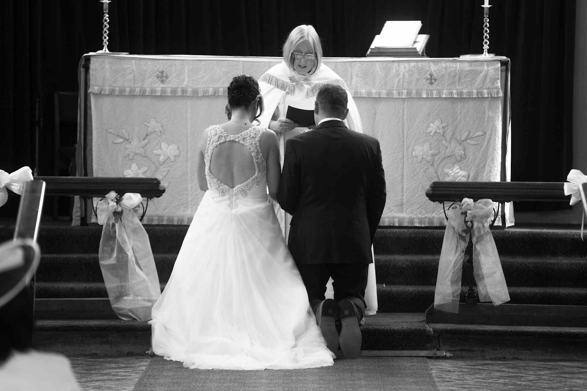 Bride & Groom kneeling at altar - Sheffield wedding