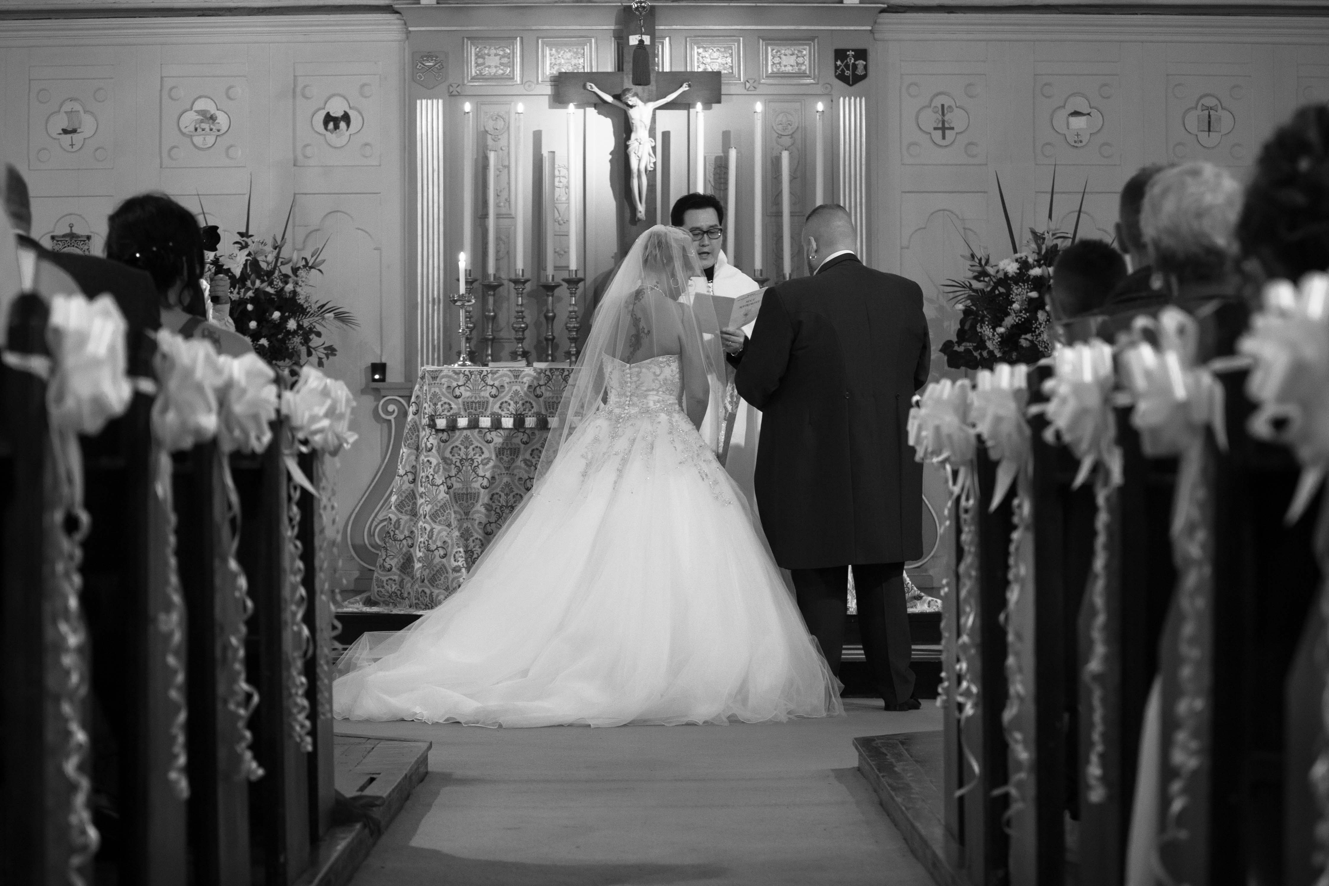 Bride, Groom & Priest at altar - Sheffield wedding