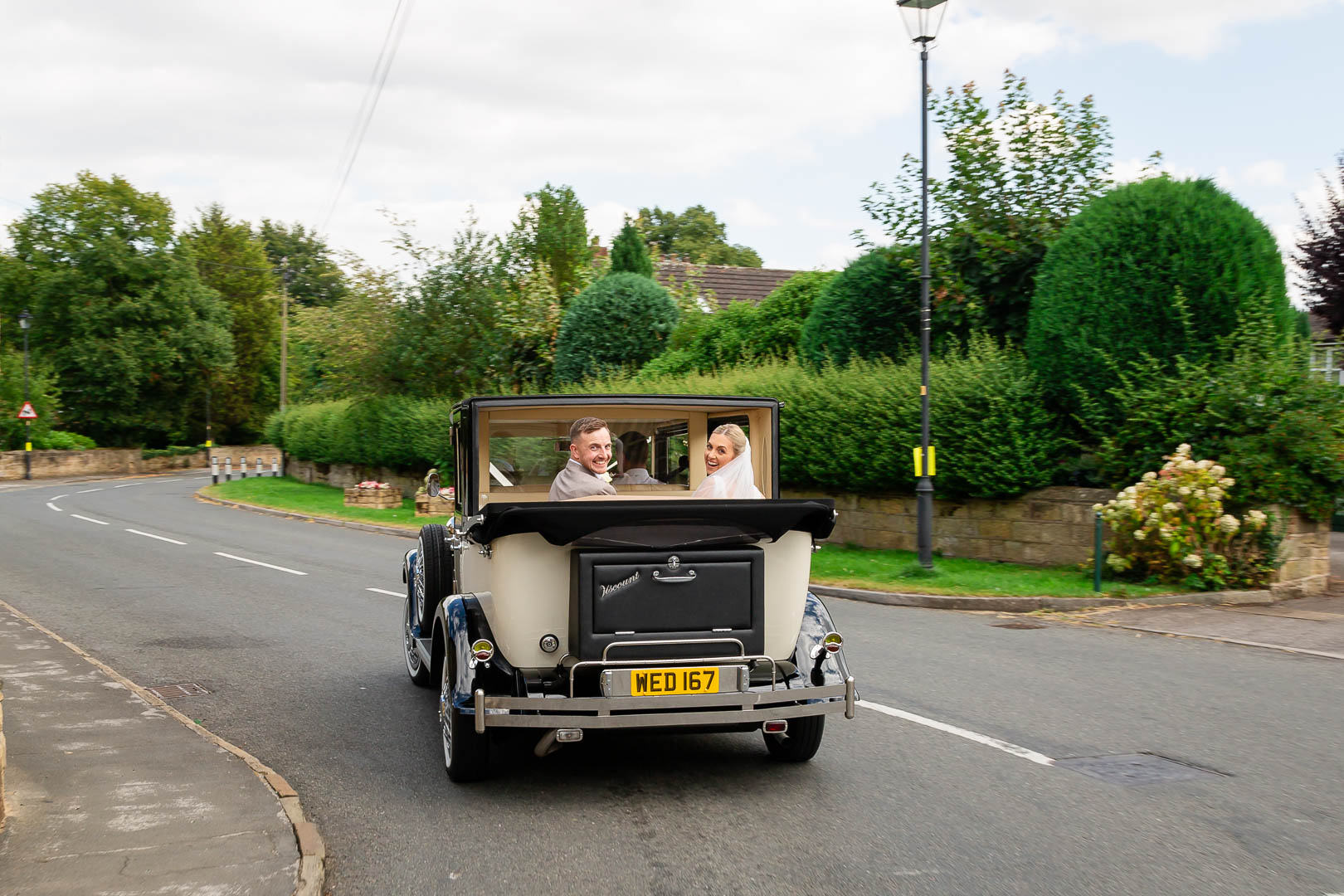 Sophie & Ash in wedding car